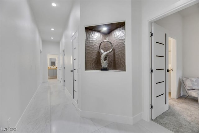 hallway with light tile patterned floors