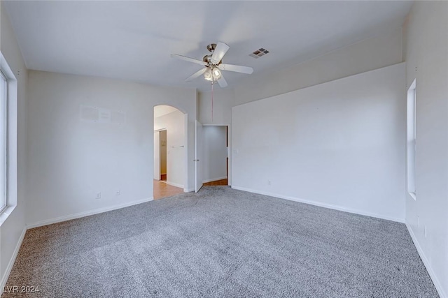 carpeted empty room with ceiling fan