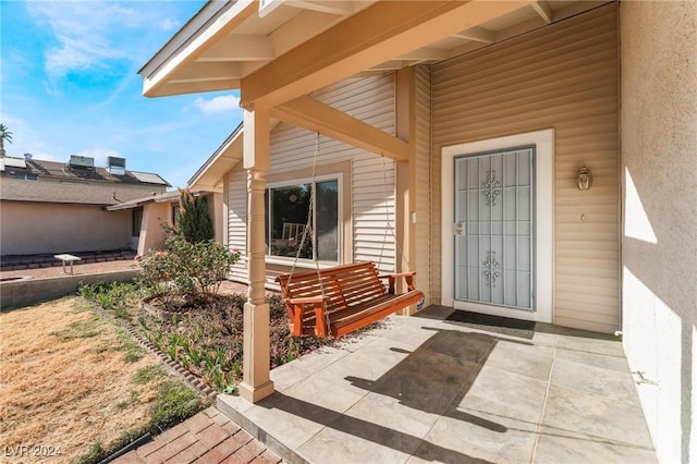 property entrance with a patio area