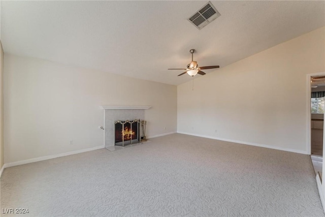 unfurnished living room featuring carpet flooring, ceiling fan, and lofted ceiling