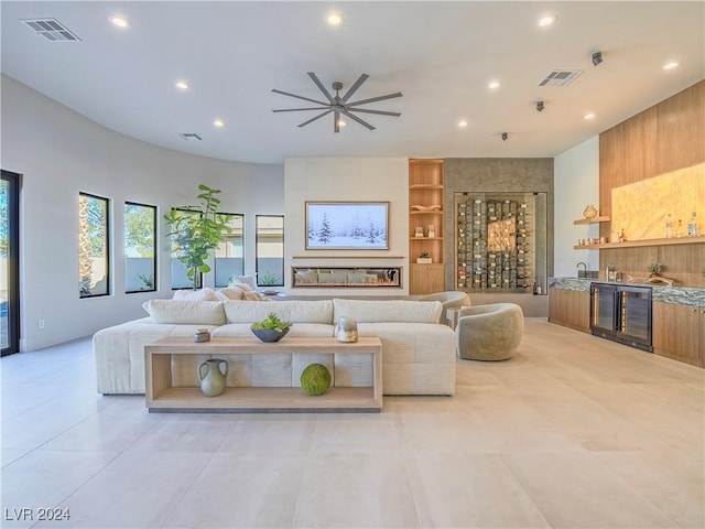 living room featuring bar area and beverage cooler