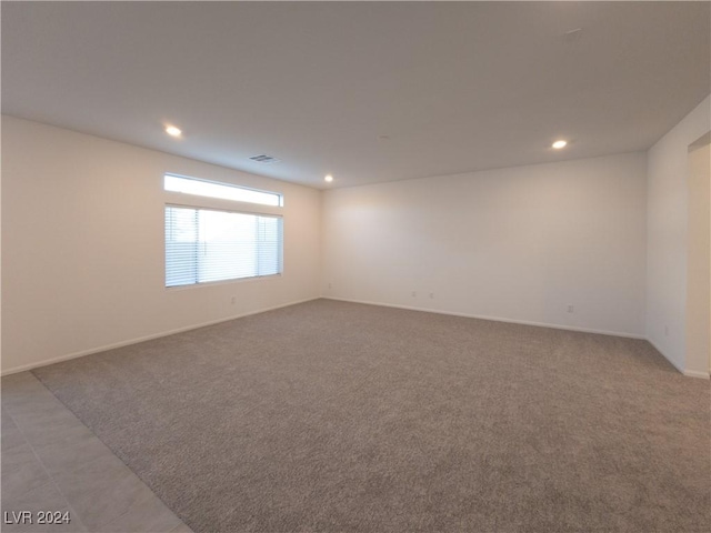 empty room featuring light colored carpet