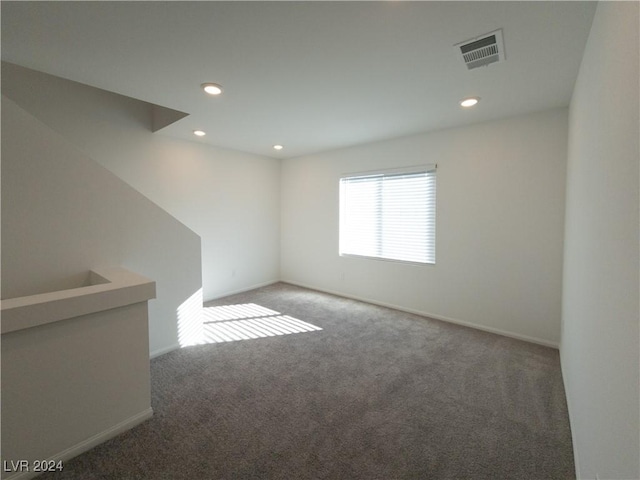 unfurnished room featuring carpet flooring