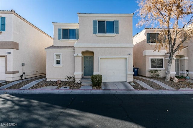 front of property with a garage