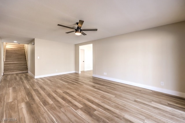 spare room featuring ceiling fan and light wood-type flooring