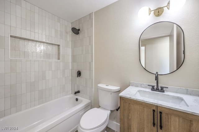 full bathroom with vanity, tiled shower / bath combo, and toilet