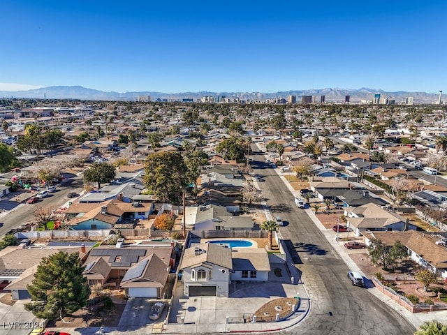 birds eye view of property with a mountain view