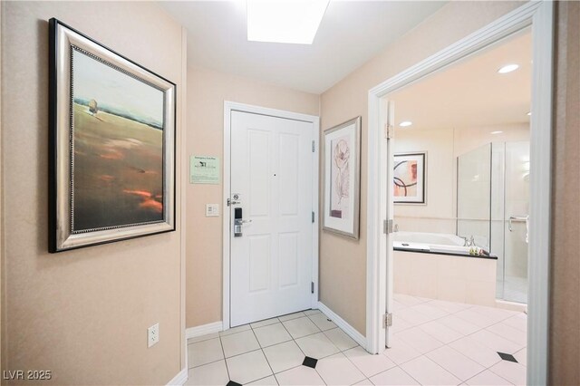 135 E Harmon Ave Unit 407, Las Vegas, NV 89109 - foyer entrance featuring baseboards, recessed lighting, and light tile patterned flooring