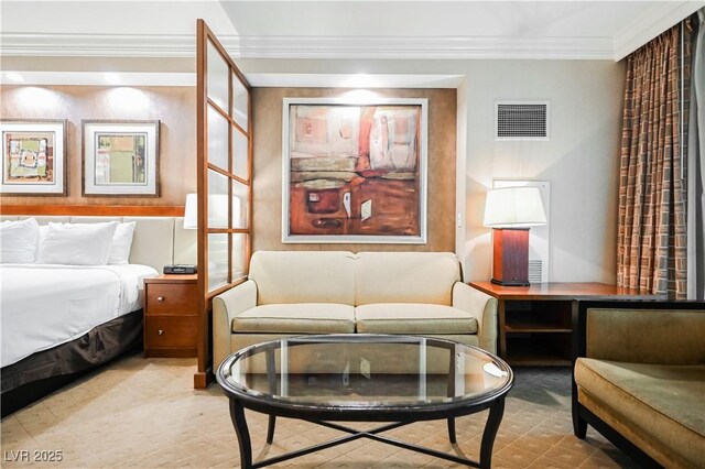 135 E Harmon Ave Unit 407, Las Vegas, NV 89109 - bedroom with visible vents and crown molding