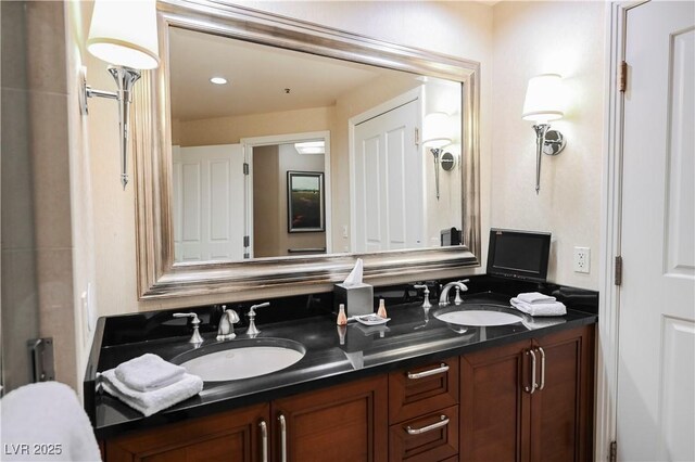 135 E Harmon Ave Unit 407, Las Vegas, NV 89109 - bathroom with double vanity and a sink