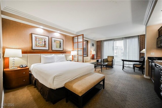 135 E Harmon Ave Unit 407, Las Vegas, NV 89109 - carpeted bedroom featuring ornamental molding