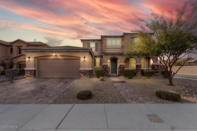 view of front of property featuring a garage