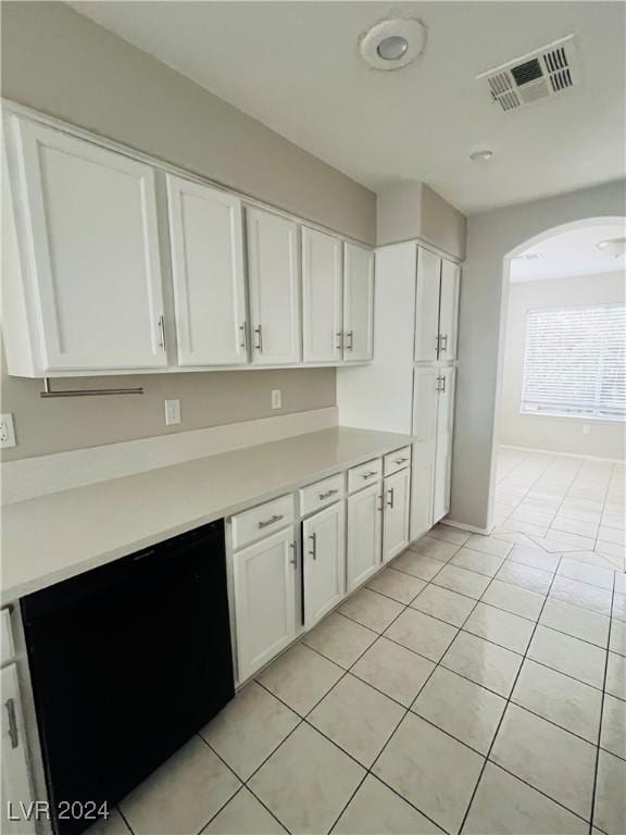 kitchen featuring white cabinets and light tile patterned flooring