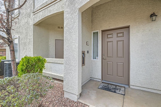 doorway to property with central air condition unit