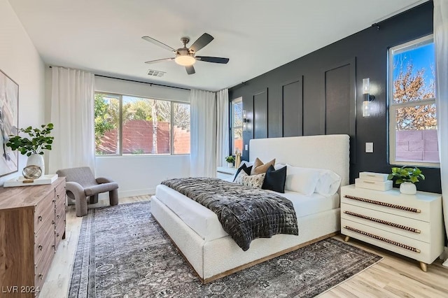 bedroom featuring wood-type flooring and ceiling fan