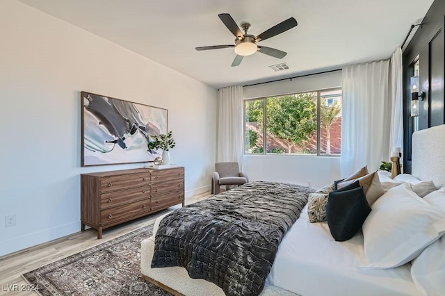 bedroom featuring hardwood / wood-style floors and ceiling fan