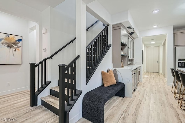 5873 Skyfall Ct, Las Vegas, NV 89135 - stairway featuring wood finished floors, recessed lighting, and baseboards