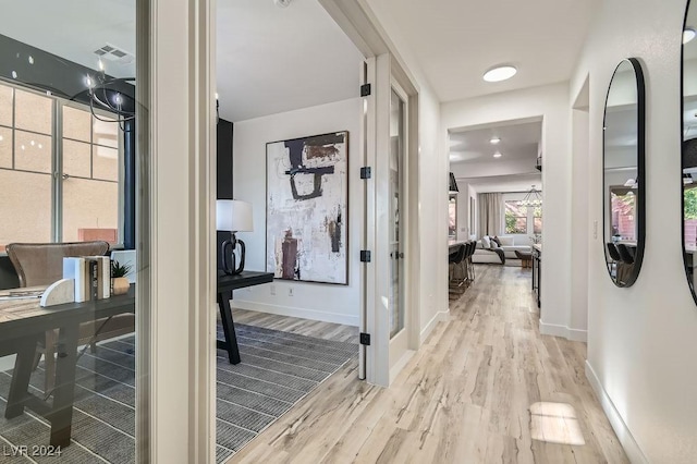 hallway featuring light hardwood / wood-style flooring