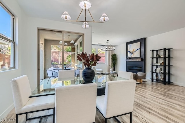 dining room featuring a fireplace and hardwood / wood-style floors