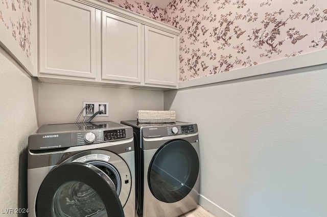 laundry area featuring cabinets and separate washer and dryer