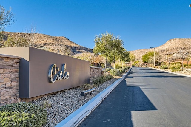 5873 Skyfall Ct, Las Vegas, NV 89135 - view of asphalt road featuring a mountain view and curbs
