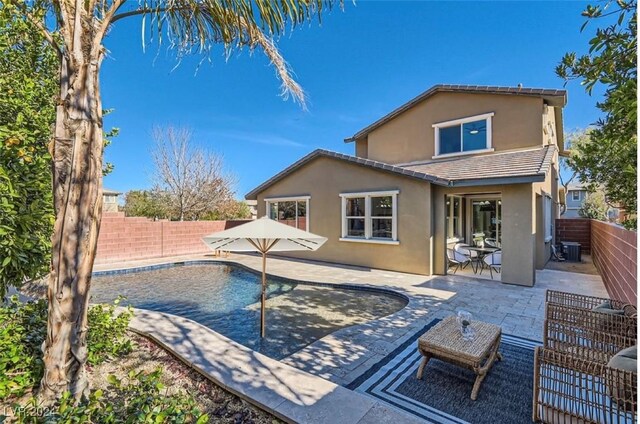 view of swimming pool with a patio and cooling unit