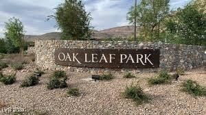 community / neighborhood sign with a mountain view