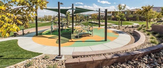 view of community featuring a playground and a yard