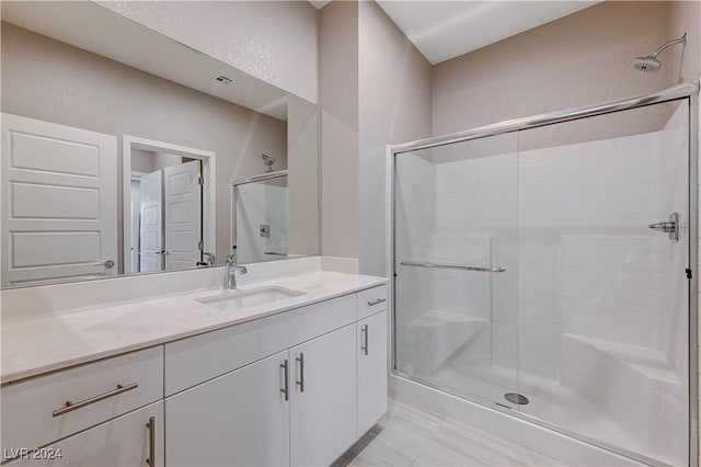 bathroom with vanity and an enclosed shower