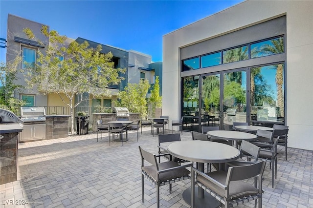 view of patio / terrace featuring area for grilling and a grill