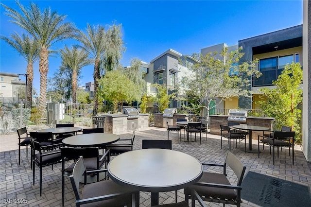 view of patio with an outdoor kitchen and grilling area