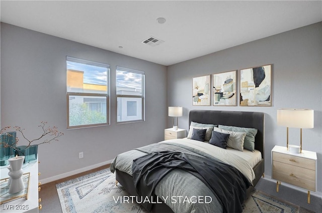 bedroom with dark colored carpet