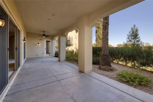 view of patio featuring ceiling fan