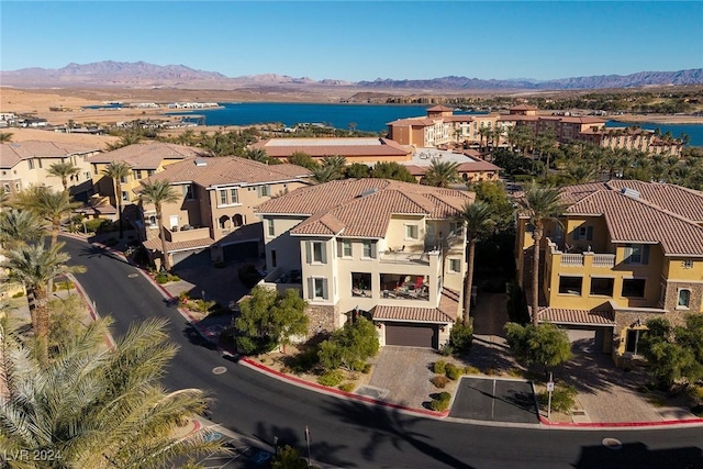 birds eye view of property featuring a water and mountain view