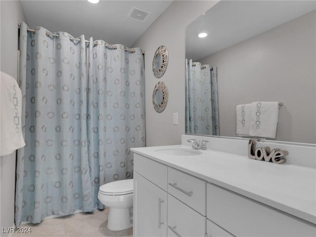 bathroom with a shower with shower curtain, vanity, toilet, and tile patterned flooring