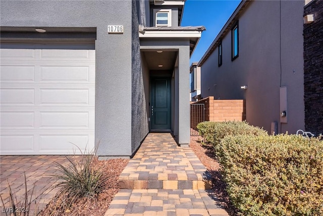 entrance to property featuring a garage