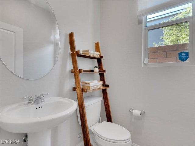 bathroom with toilet and sink