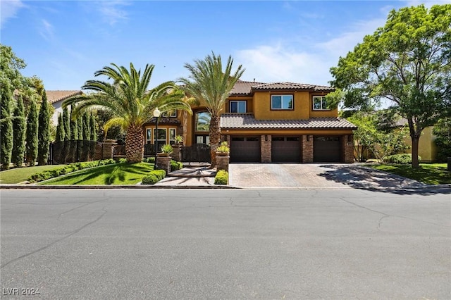 mediterranean / spanish-style house with a garage