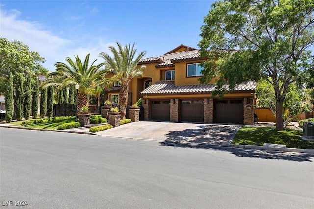 mediterranean / spanish home featuring a garage