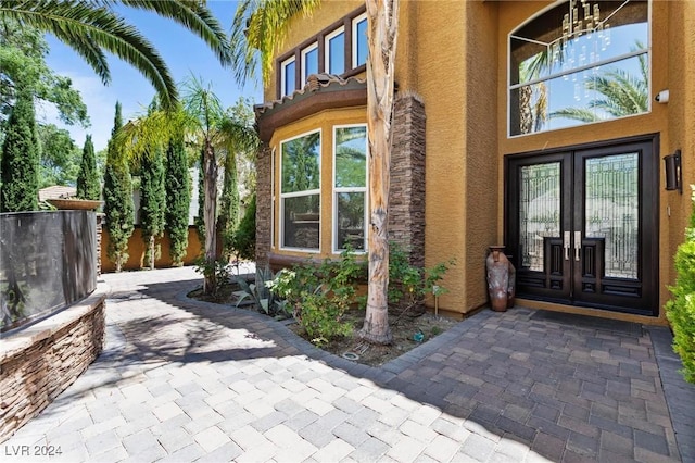 view of exterior entry featuring french doors