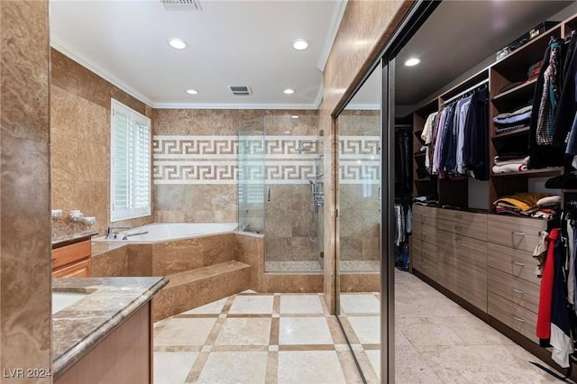 bathroom with vanity, independent shower and bath, tile walls, and ornamental molding