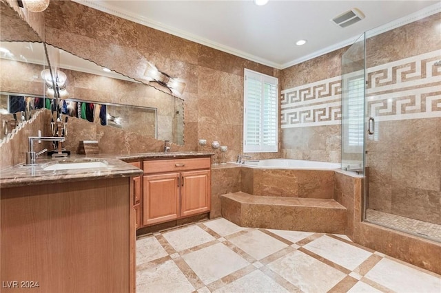 bathroom featuring vanity, crown molding, shower with separate bathtub, and tile walls