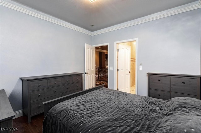 bedroom featuring dark hardwood / wood-style floors and crown molding