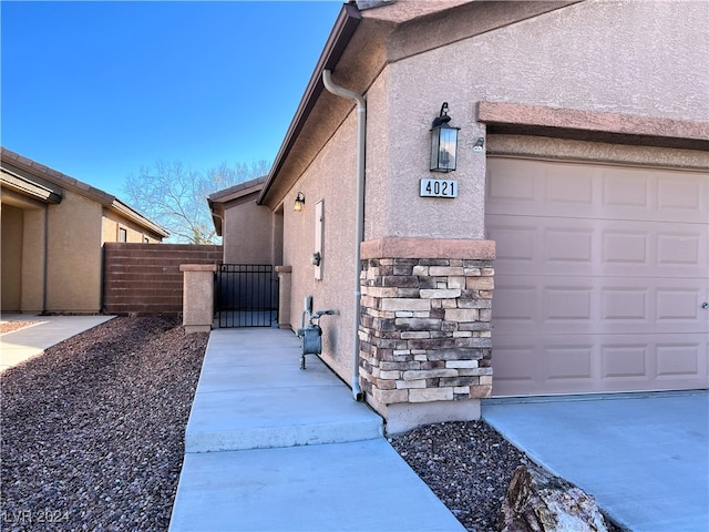 view of property exterior with a garage