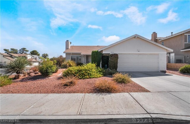 single story home with a garage