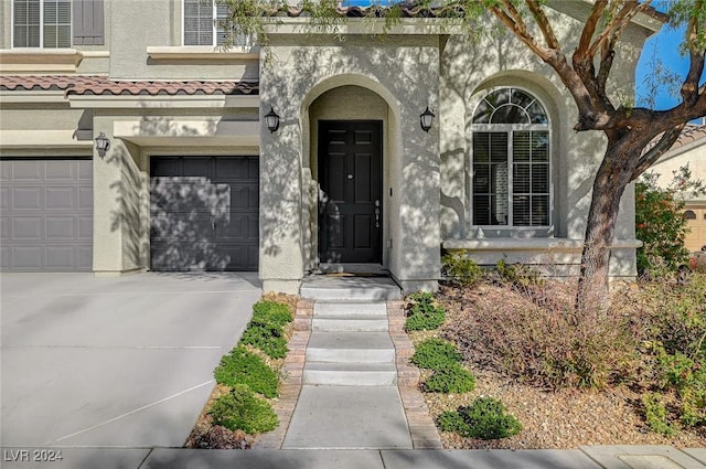 doorway to property featuring a garage