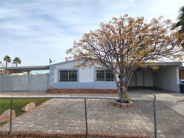 ranch-style home with a carport