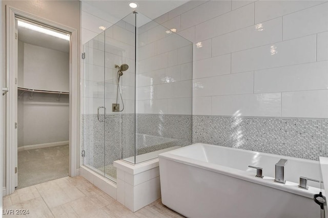 bathroom featuring plus walk in shower