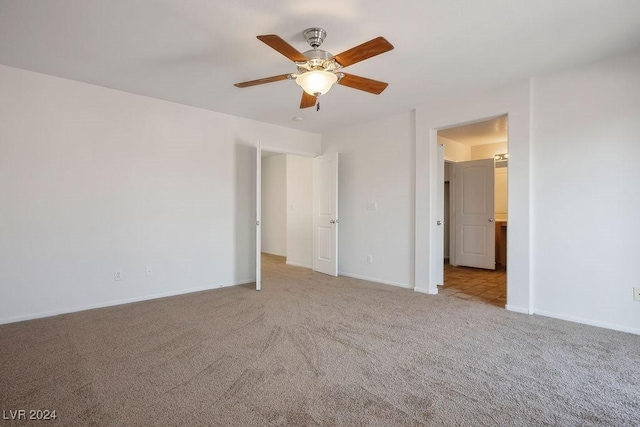 interior space with baseboards and ceiling fan