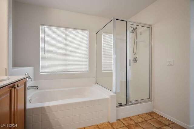 bathroom featuring vanity and separate shower and tub